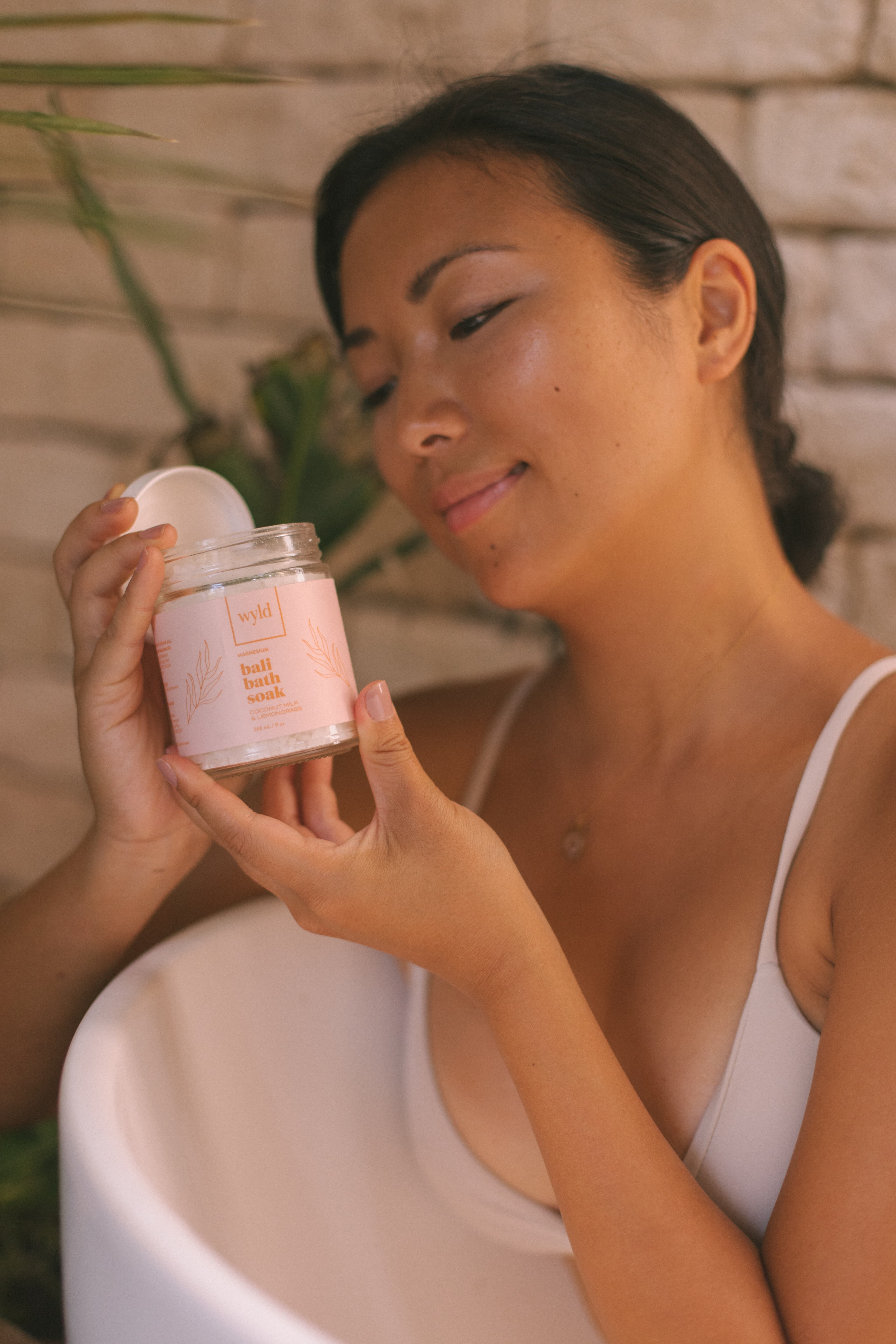 Woman holding Wyld bath soak