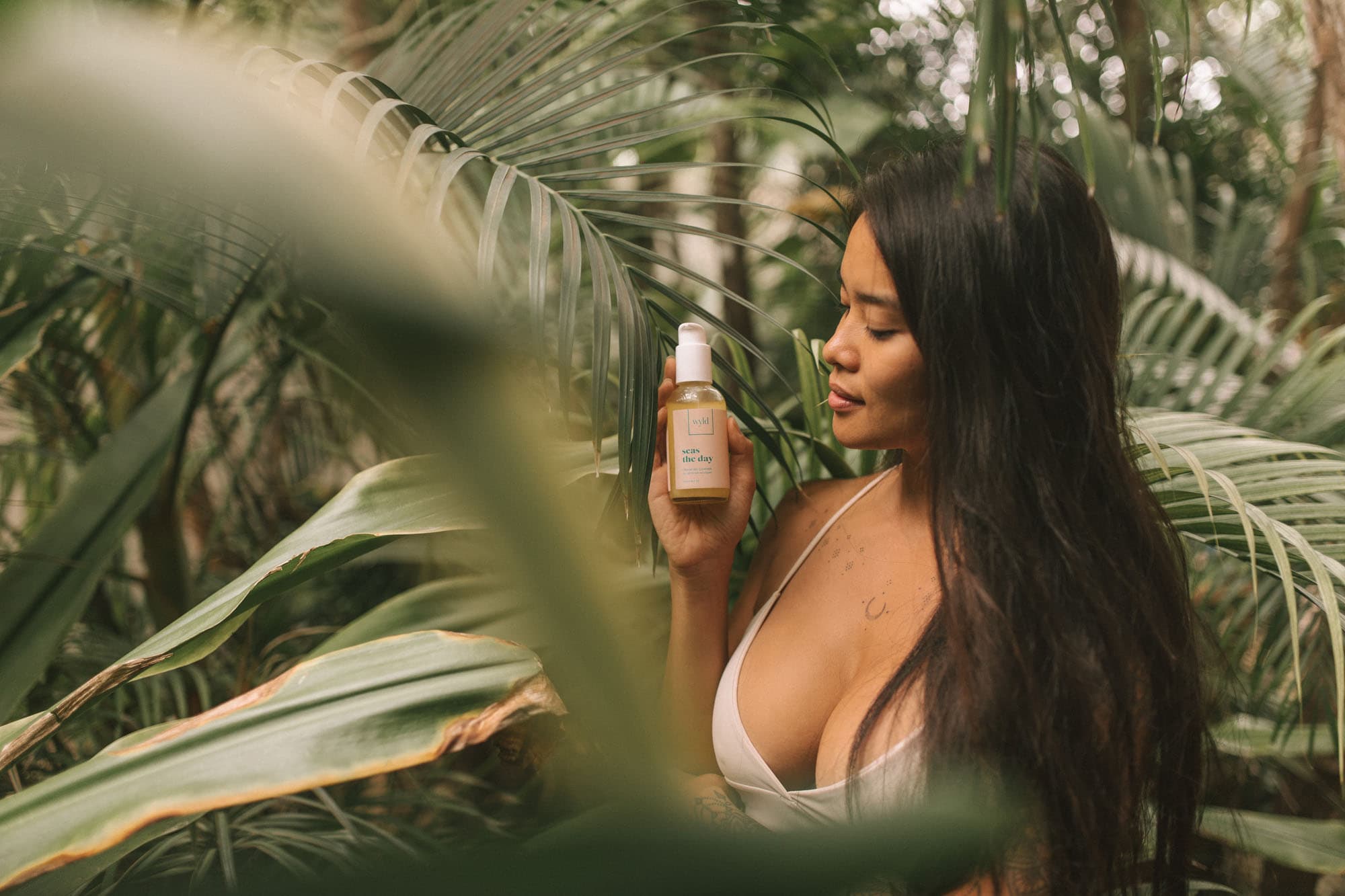 Woman applying skincare in a calming ritual