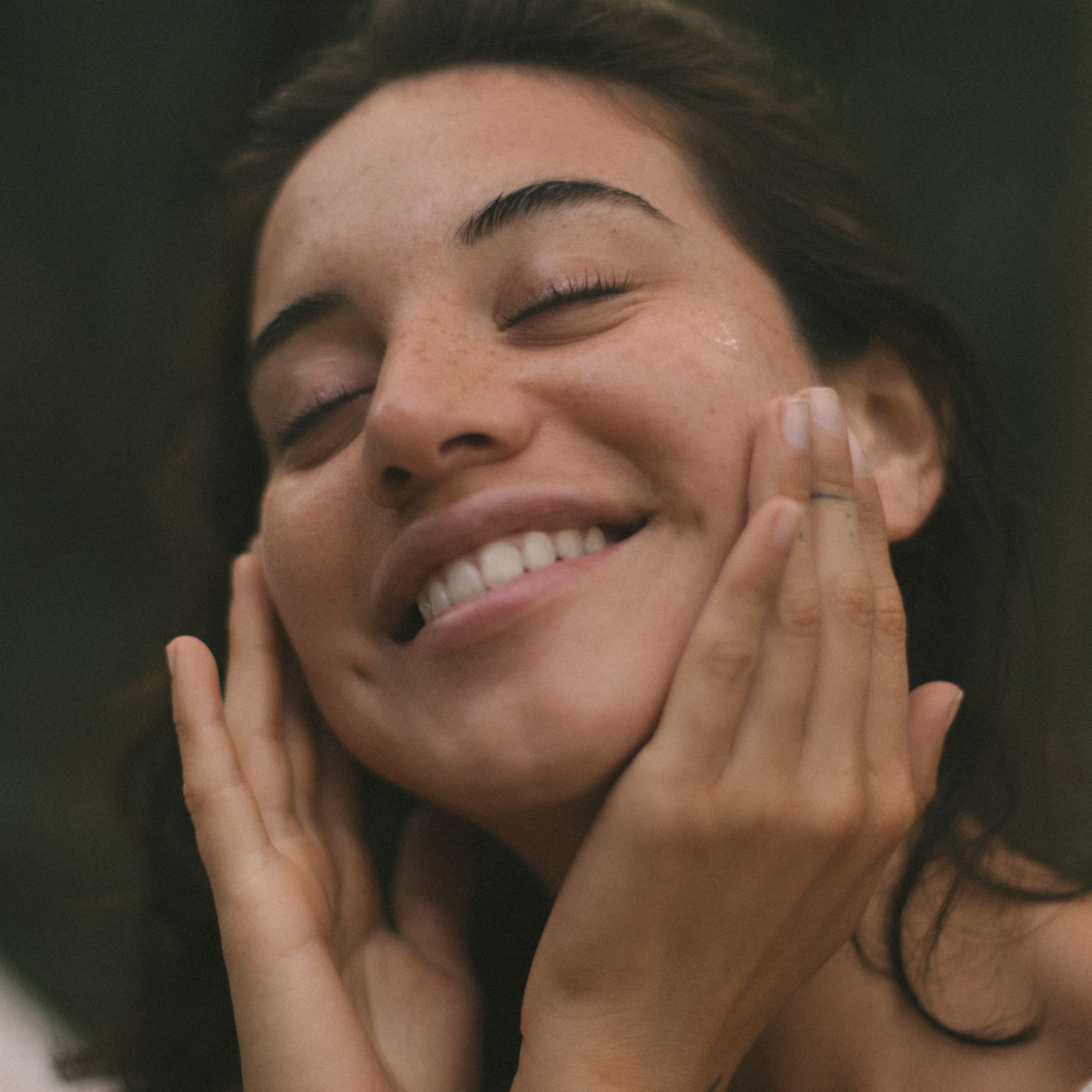 Woman with calm, glowing skin after her ritual