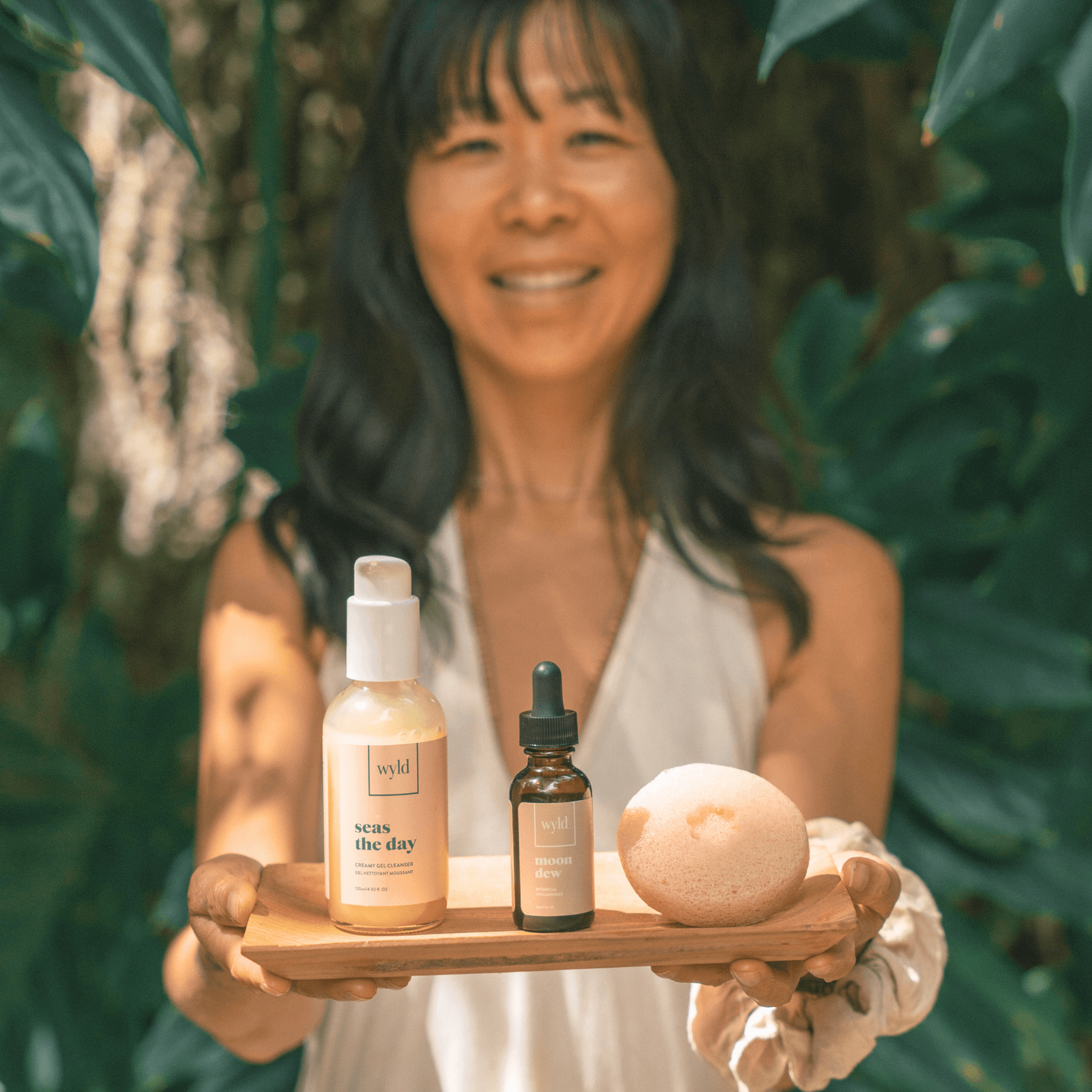 Joy, founder of Wyld, holding the Skin Peace Ritual set