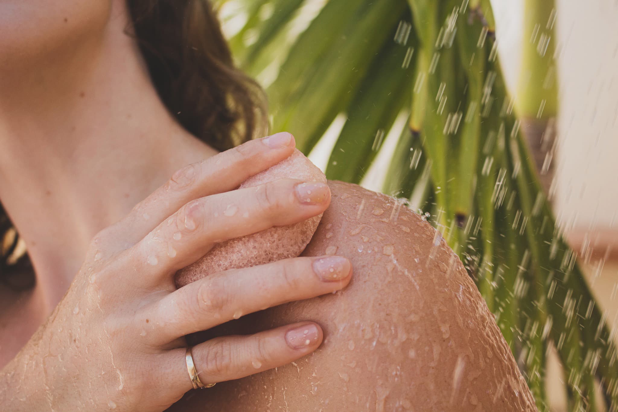 Konjac sponge used on the skin under running water